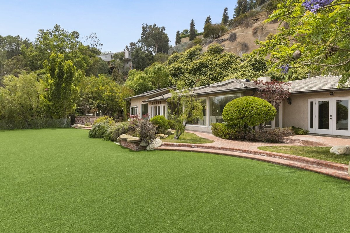 Front elevation and lawn of 1450 N Bella Dr, a Los Angeles property represented by Jeff Wong
