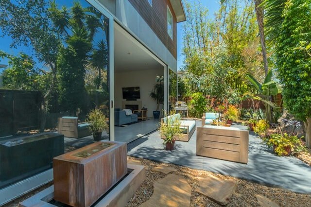 Rear patio and garden of 2425 Clement Ave, a Los Angeles property represented by Jeff Wong